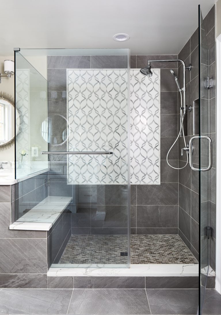 Case design remodeling master bathroom with stand up, sit down shower with frameless shower door
