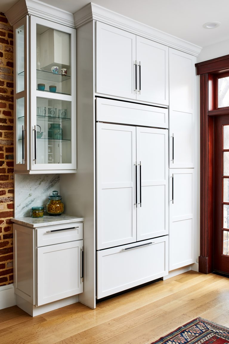 bright white cabinets along with all hardwood floor