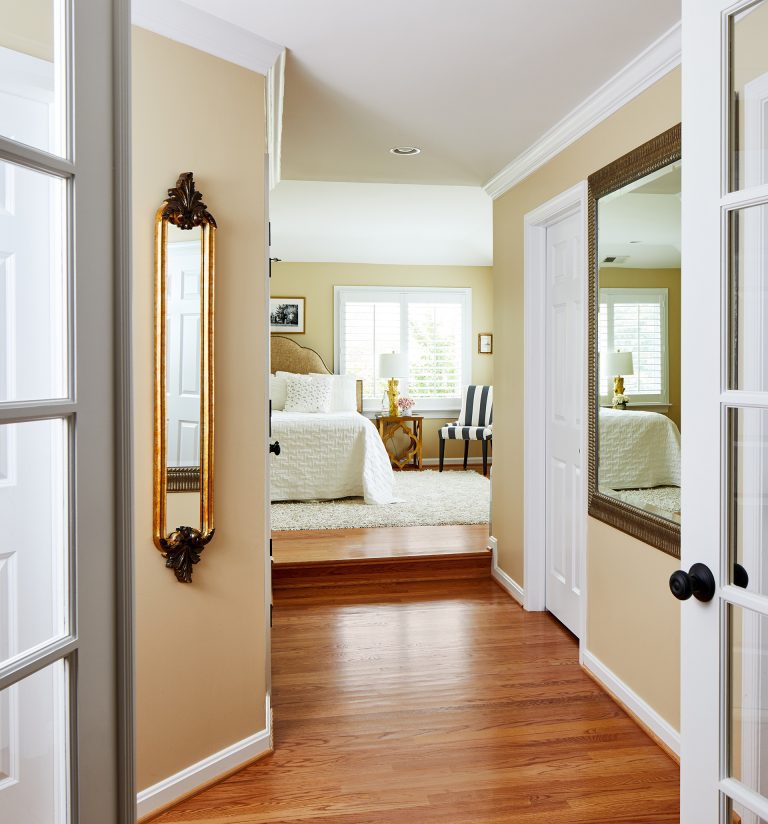 Double doors leading to master bedroom with hard wood flooring
