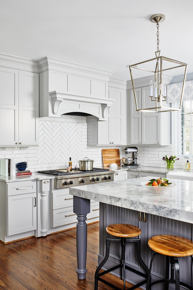 design build northern Virginia kitchen gold pendant lights over kitchen island storage and tuck-a-away seating