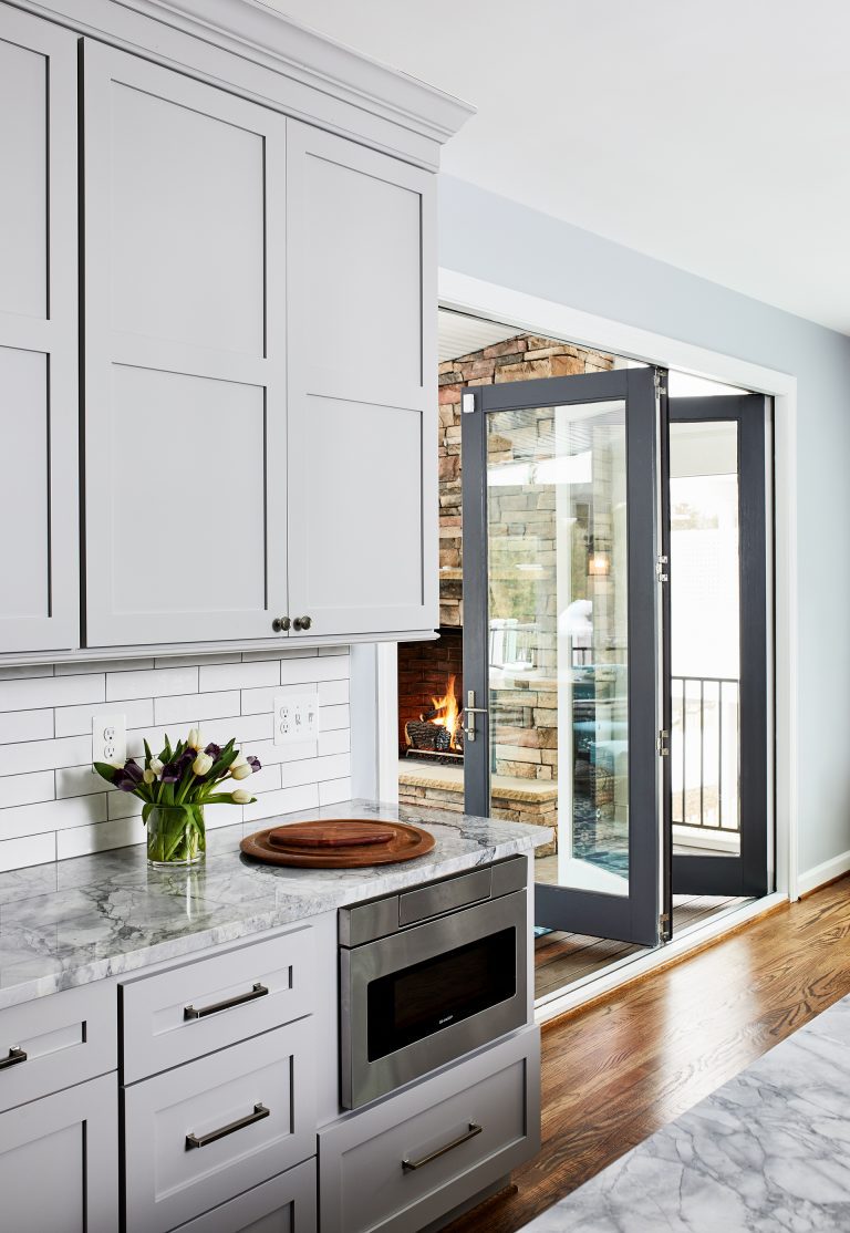 Grey frame glass double doors for dividing living room and kitchen