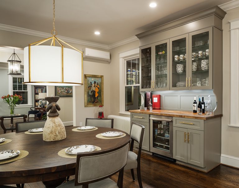 glass front cabinets with gold pendant light