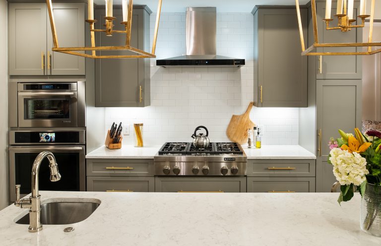 case design kitchen with brushed gold light fixtures