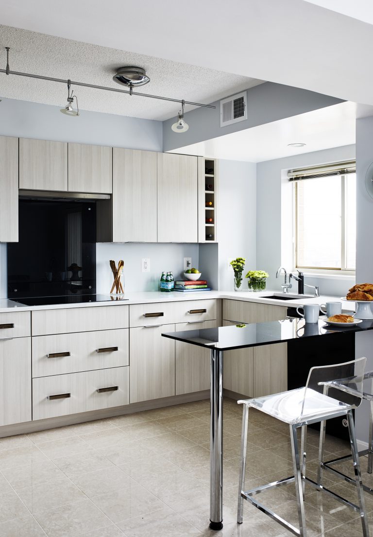 Design build northern Virginia with black backsplash and table with bar stool