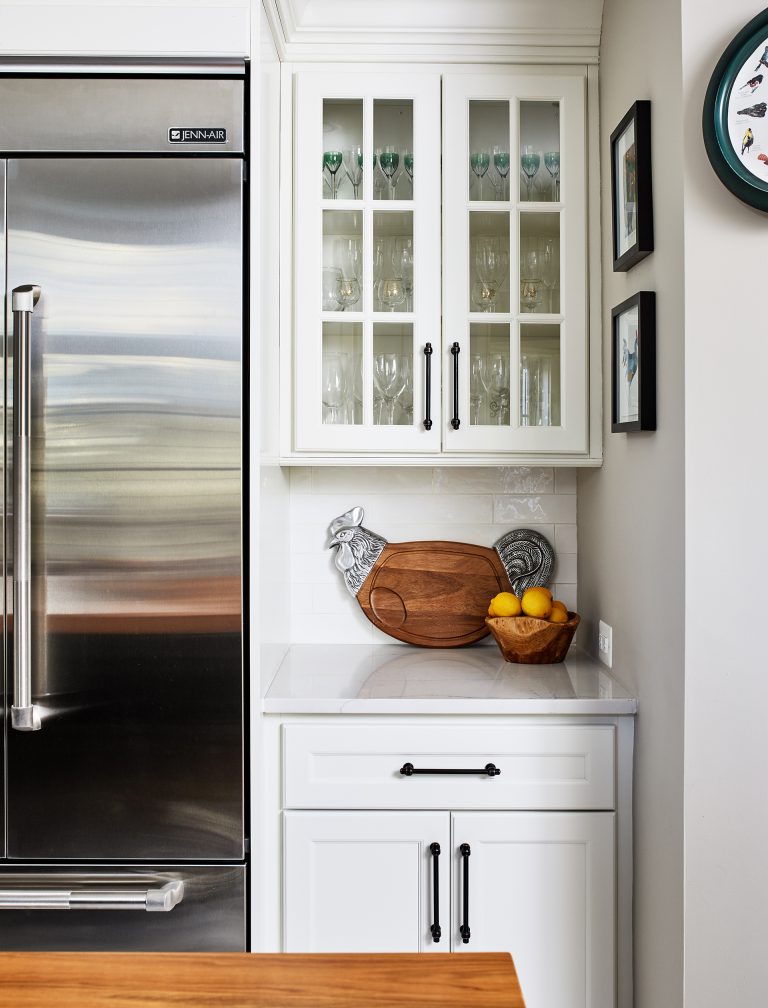 kitchen with stainless steel appliance with glass cabinets doors