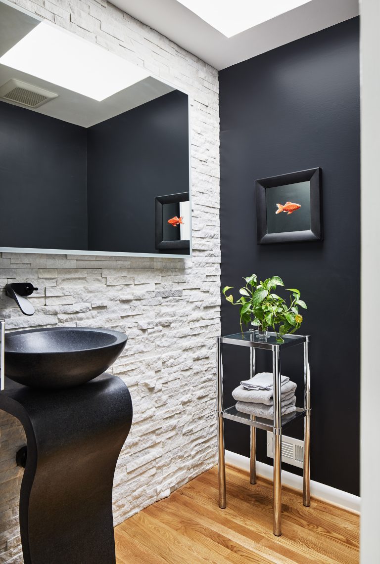 case design build black and white bathroom equipped with a black washstand