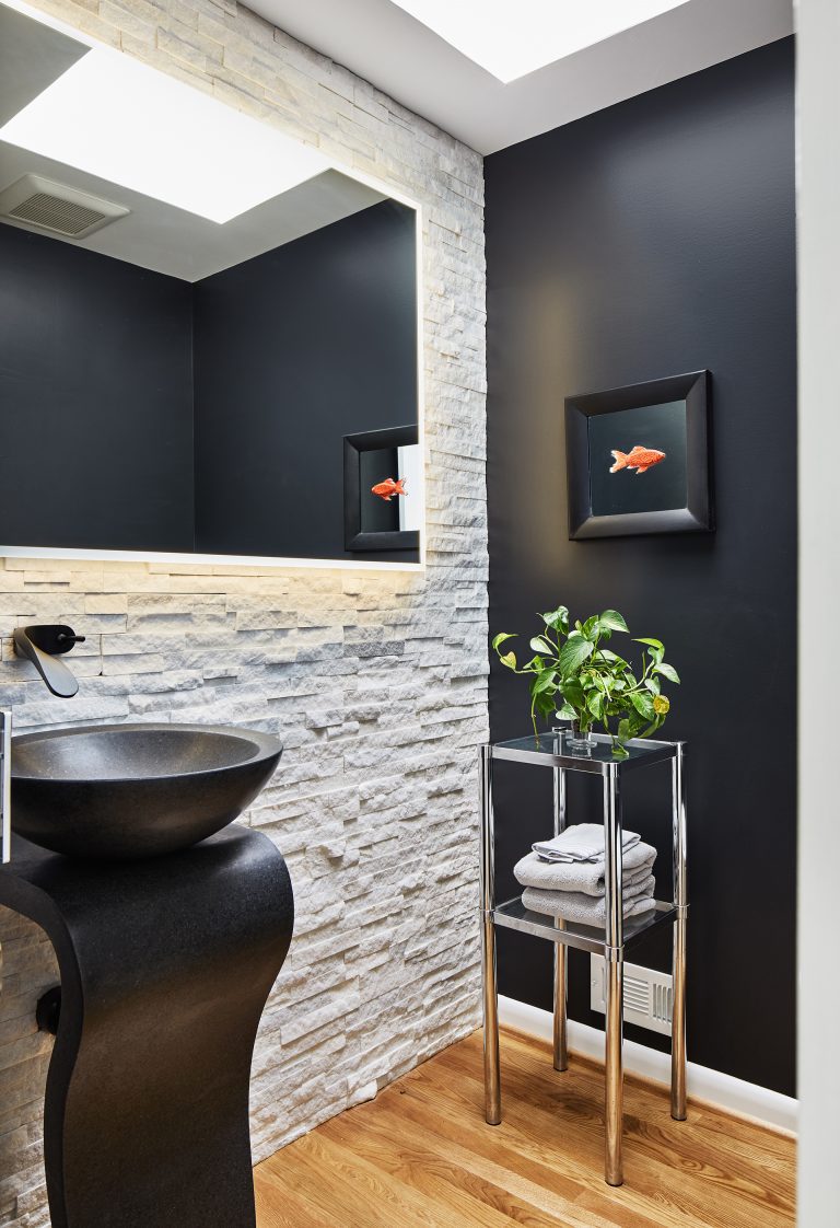 white and black bathroom features half of wall