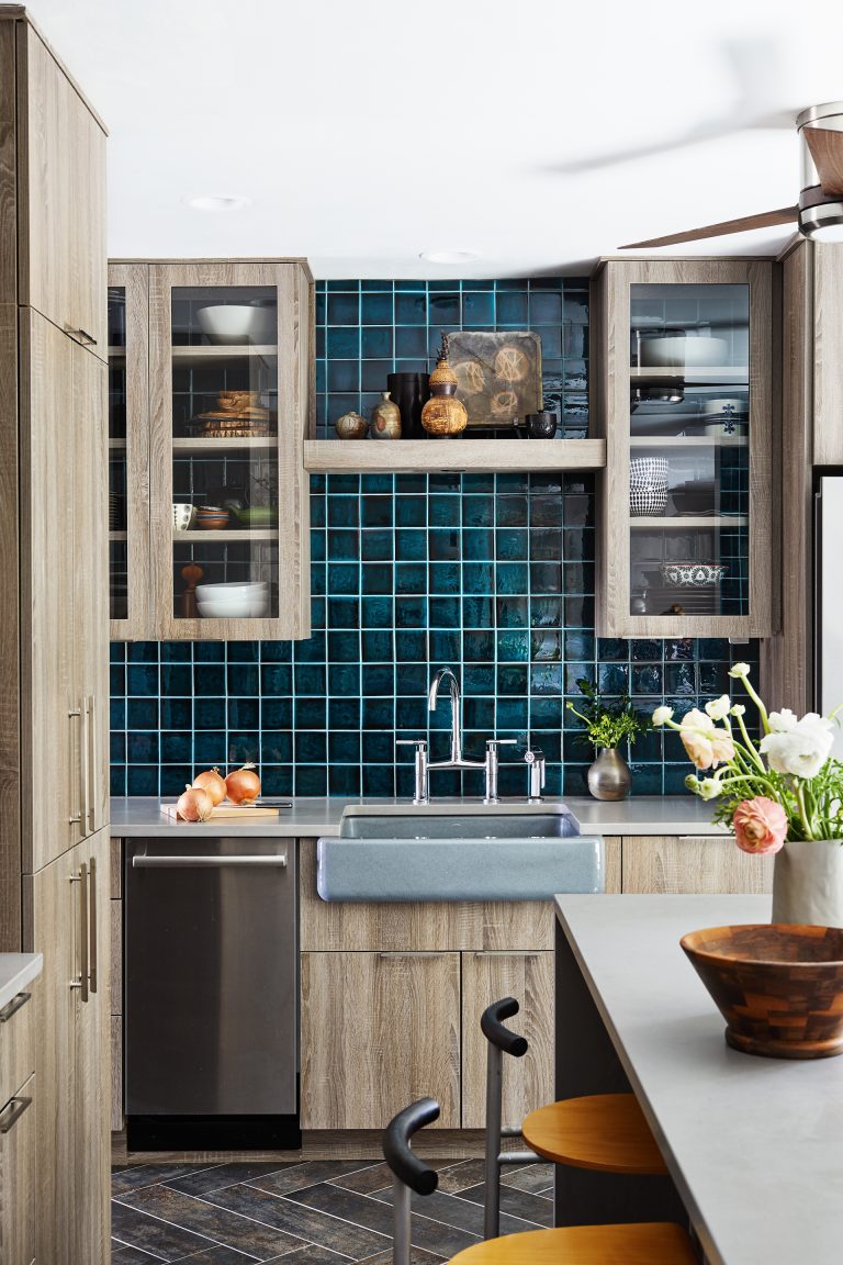 renovated virginia kitchen with natural wood cabinetry and teal tiling