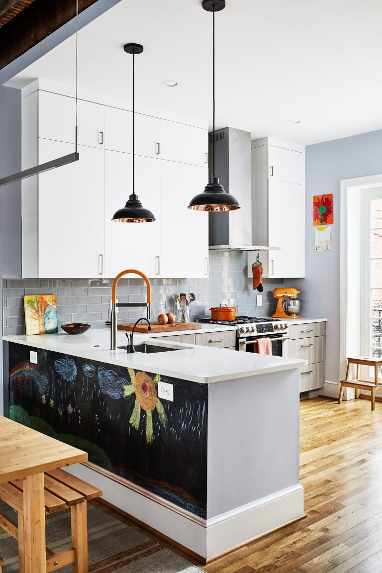 gray and white DC kitchen with wood floors glass doors and chalkboard on back of peninsula