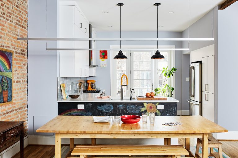 kitchen renovation in DC home bright and open to dining area exposed brick wall