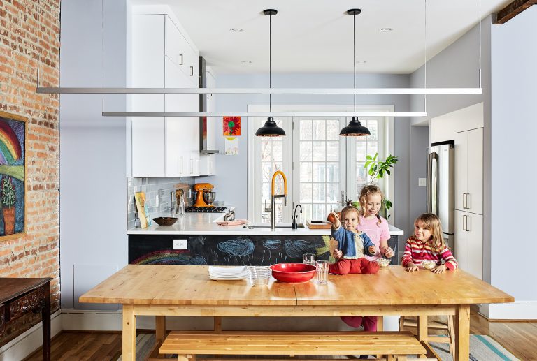 kitchen renovation in DC home bright and open to dining area exposed brick wall