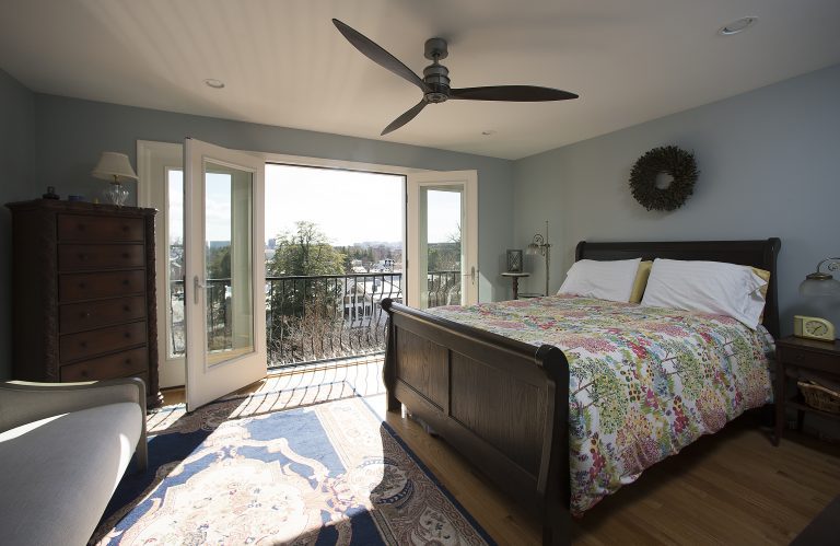 bedroom renovation light blue walls french doors to outside