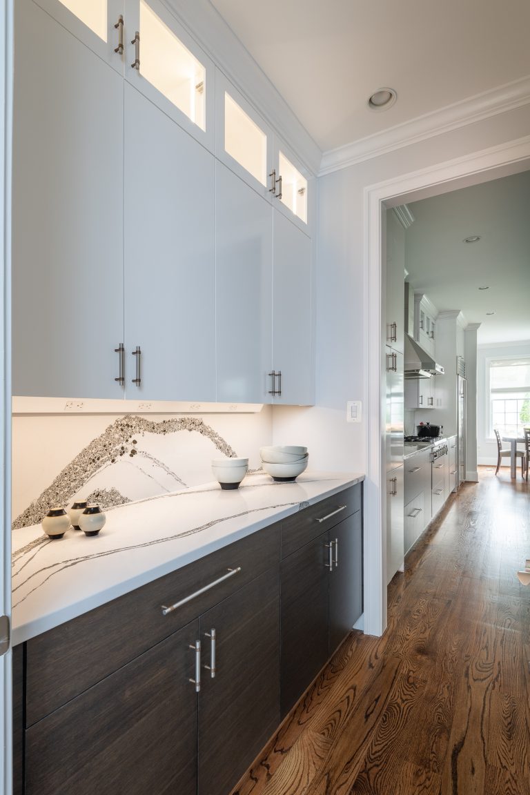 hard wood floors with brown bottom cabinets and white top pull handles cabinets with glass opening