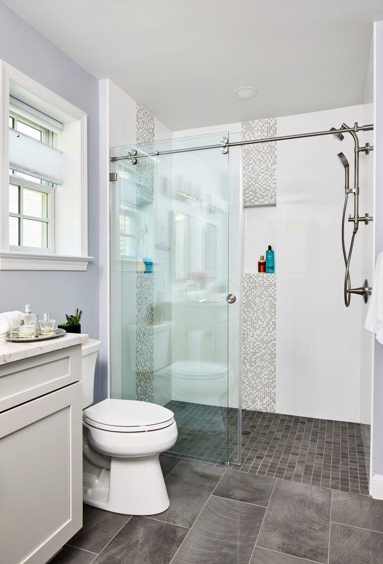 Bathroom with grey floor tile and white gloss ceramic wall tile