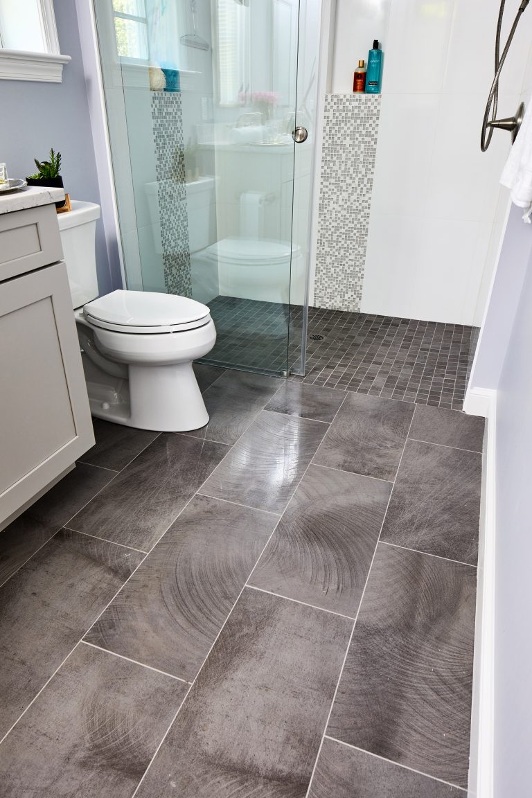 brick pattern tile flooring bathroom with walk in shower