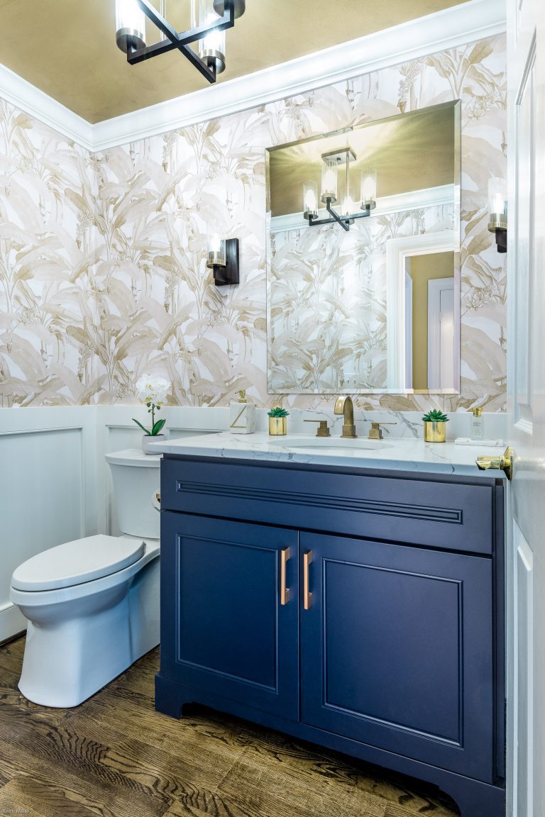 bathroom remodeling in Maryland with beautiful marble countertop with blue vanity with pull handles