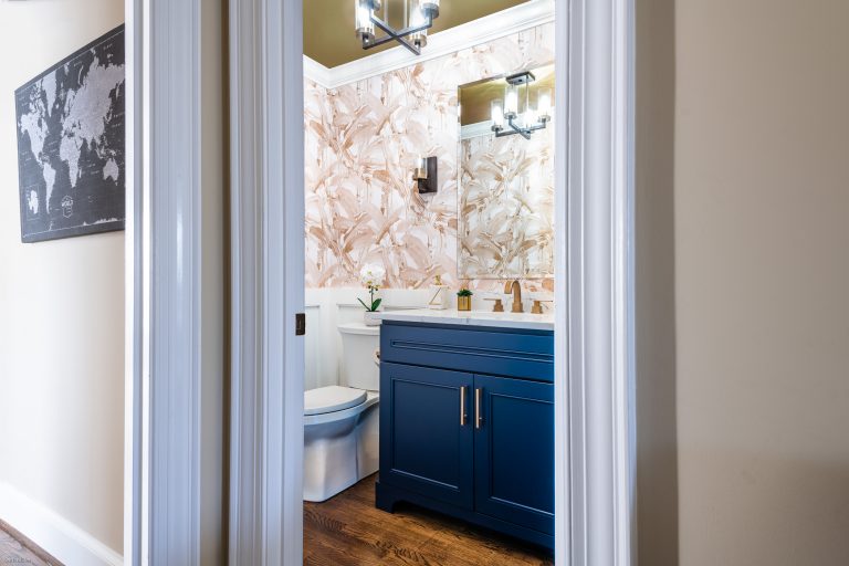 Case design remodeling transitional Maryland bathroom with hard wood flooring, gold ceiling, white floor standing one-piece toilet