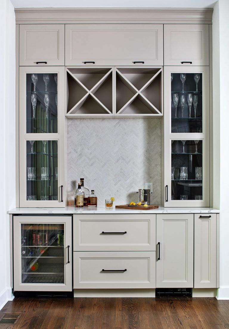 mini bar area with white cabinetry upper cabinets with glass doors beverage refrigerator and wine storage