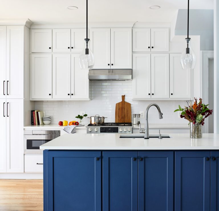 dc remodeling kitchen with white subway backsplash, two single bell pendants above kitchen island