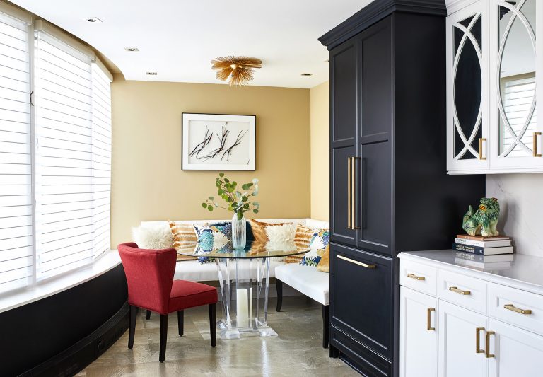 case kitchen with a small corner dining room glass table