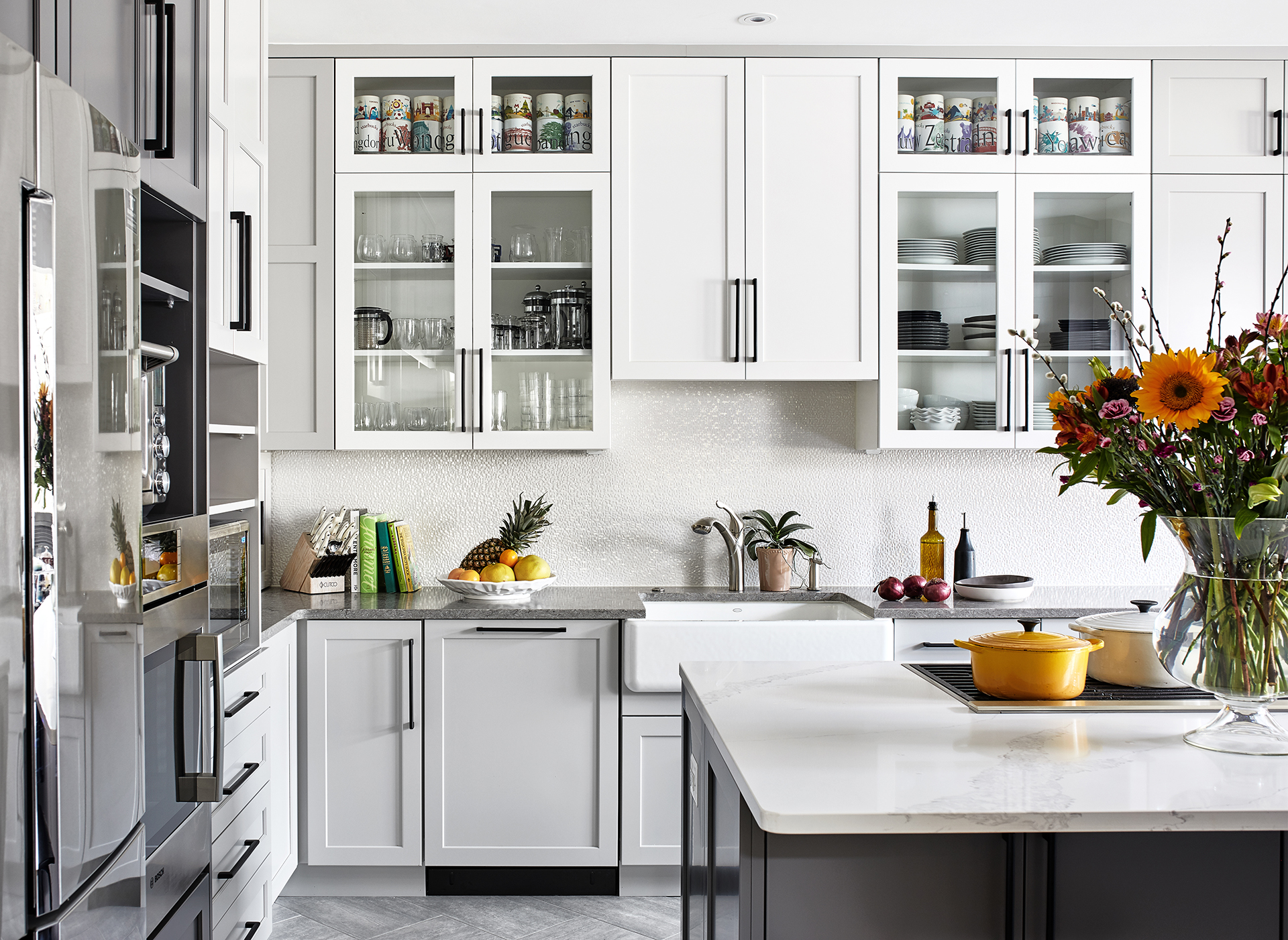 Maryland transitional shades of grey kitchen with white kitchen island top and grey base, white cabinets with black pull handle