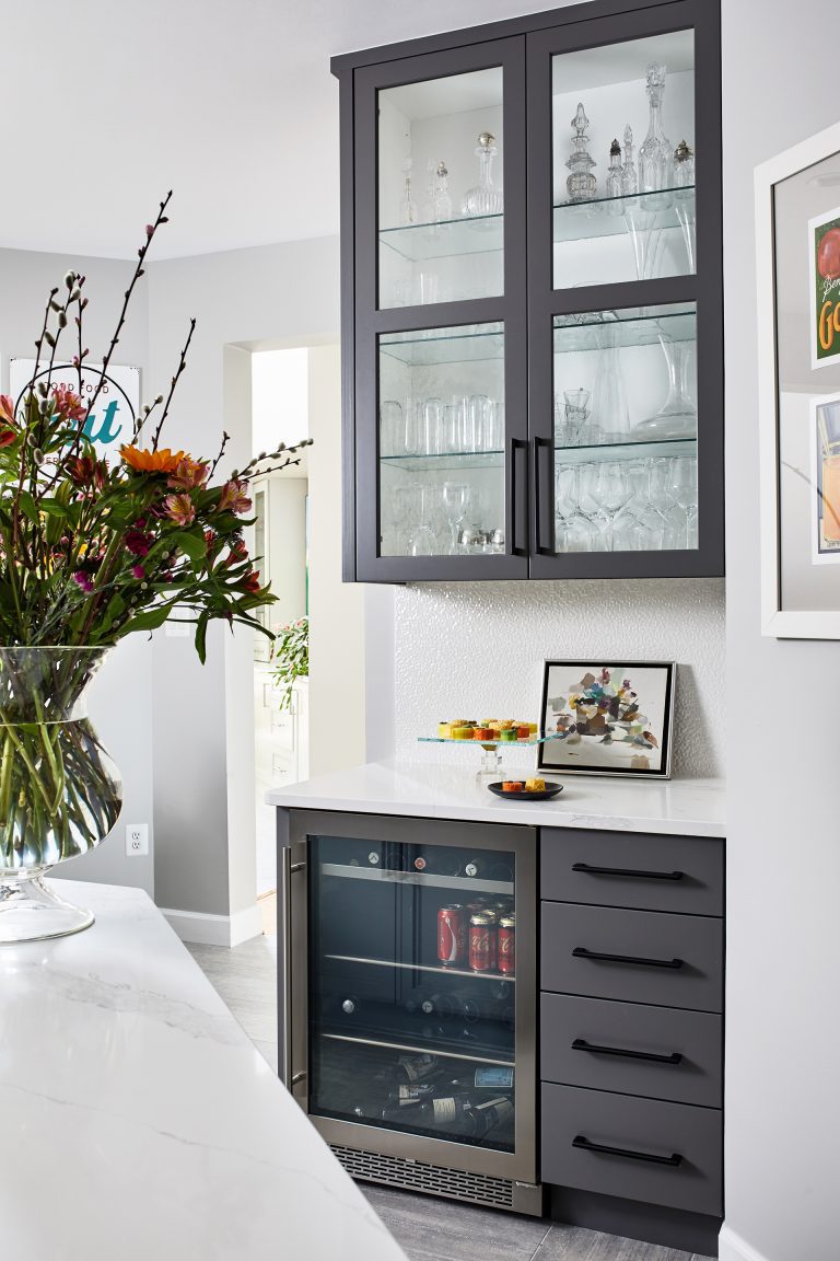 transitional md kitchen with see through under counter fridge with 4 pull out draws and black pull handles above glass cabinet