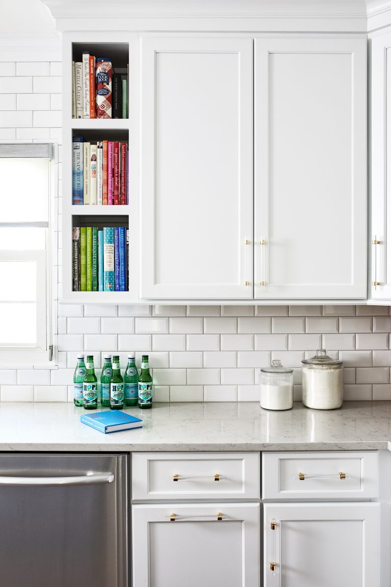 white cabinets with white subway back splash