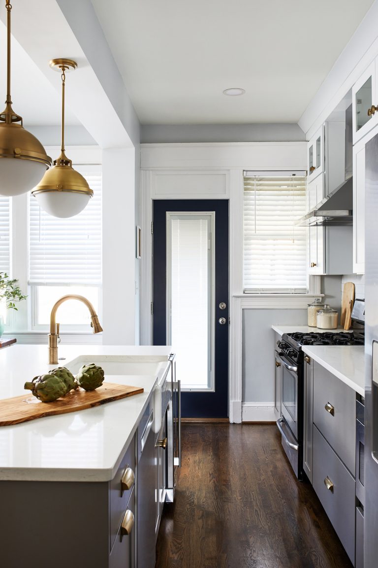 transitional white and grey dc kitchen remodeling with wood floors with pull out kitchen cabinets with gold pull handles